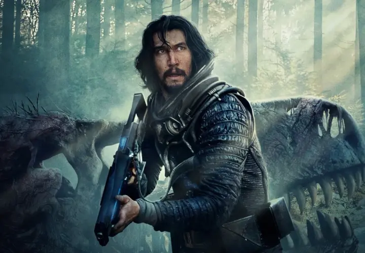 Adam Driver w futurystycznym stroju z bronią, obok szkieletu dinozaura. Scena z jednego z jego filmów.