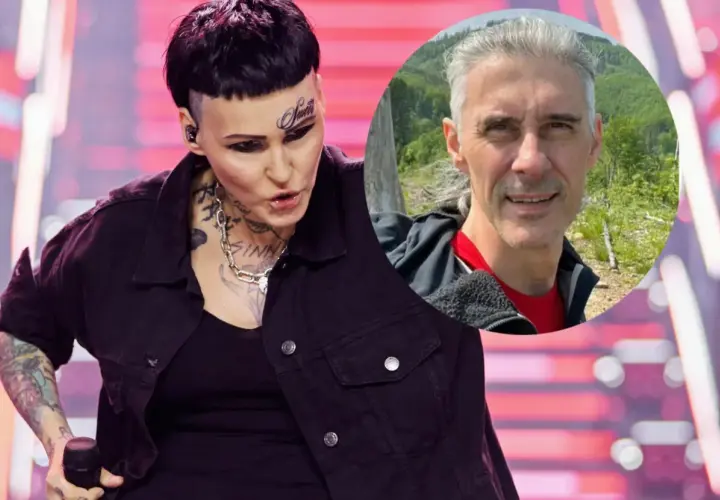 Agnieszka Chylińska z mężem na zdjęciu. Ona na scenie, on w tle na tle natury.