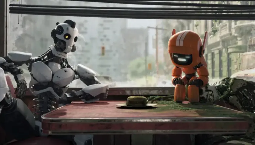 Dwa roboty siedzą przy stole w zniszczonym mieście. Jeden, duży i biały, wygląda na zamyślonego. Drugi, mały i pomarańczowy, patrzy na burgera. To scena z "Miłość, śmierć i roboty".