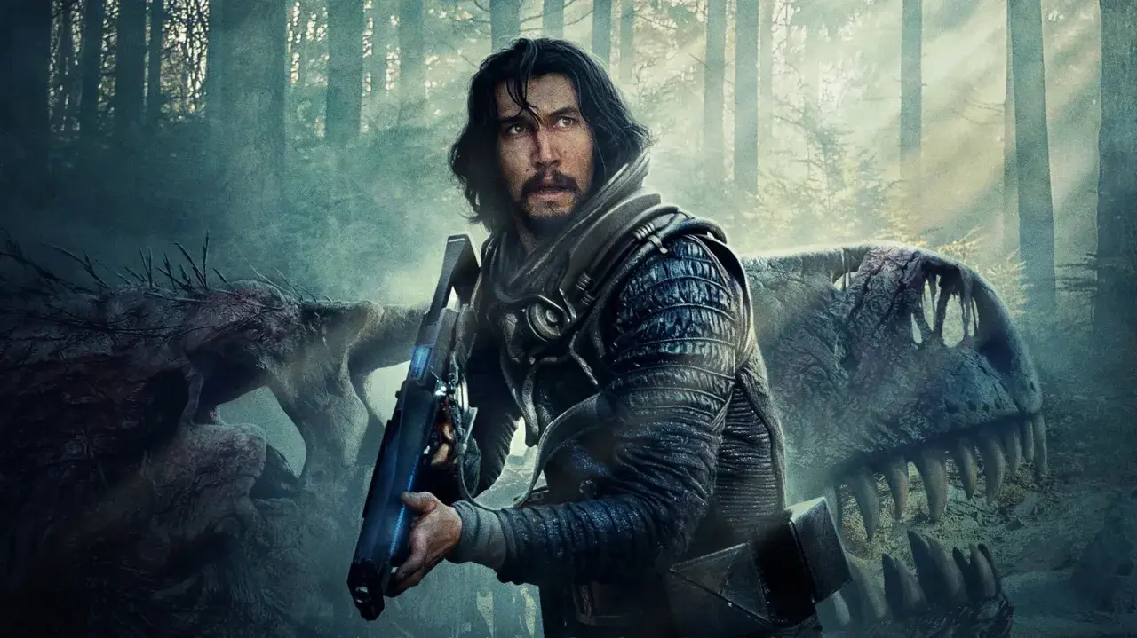 Adam Driver w futurystycznym stroju z bronią, obok szkieletu dinozaura. Scena z jednego z jego filmów.