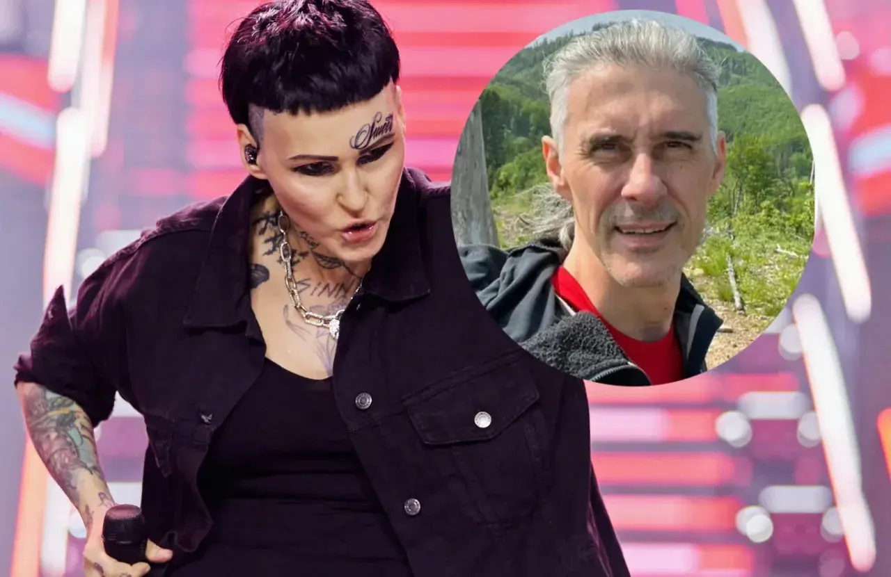 Agnieszka Chylińska z mężem na zdjęciu. Ona na scenie, on w tle na tle natury.